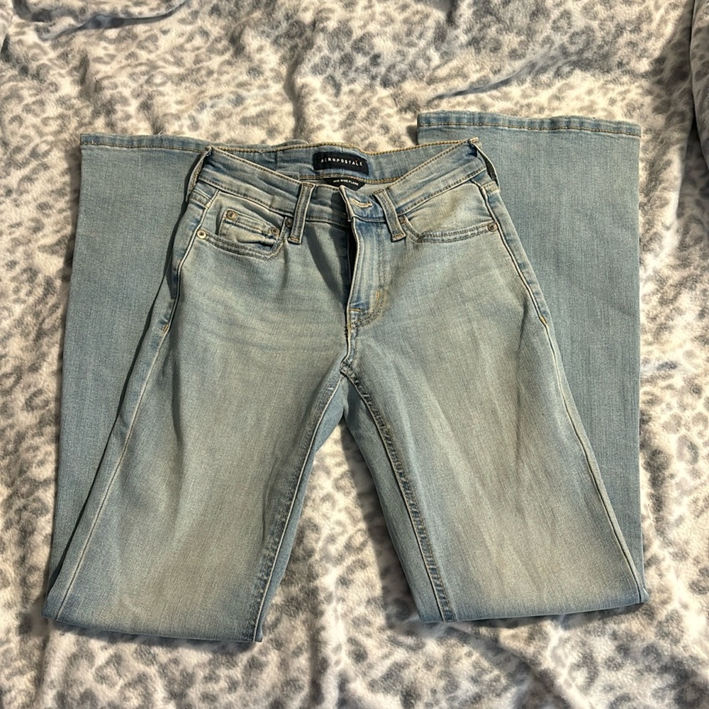 Mid rise light washed none ripped flared jeans